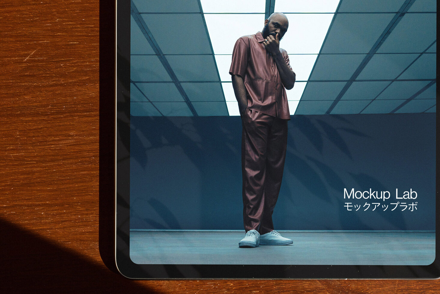 Tablet with fashion-themed mockup on screen featuring a model in a modern outfit. Ideal for designers seeking high-quality presentation templates.