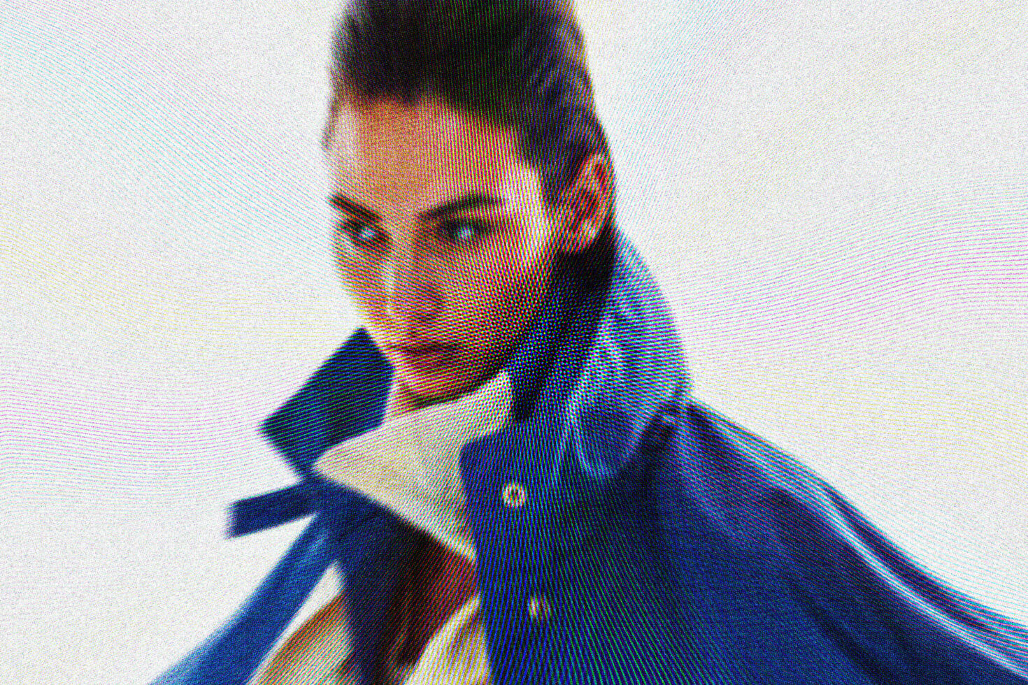 Stylized portrait featuring a person in a blue jacket with high collar, showcasing pixelated texture. Perfect for fashion graphics and design inspirations.