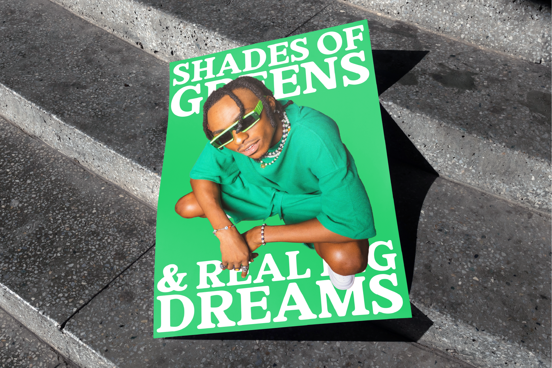 Poster mockup featuring person in green outfit and sunglasses on concrete steps Keywords design asset graphic template fashion colorful trendy display