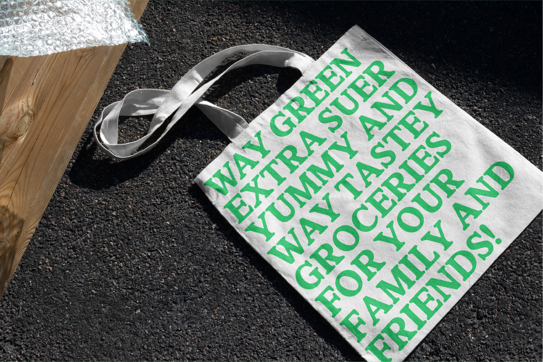 Eco-friendly tote bag with green text saying Way Green Grocery for Designers Mockup template natural fiber reusability sustainable shopping accessory