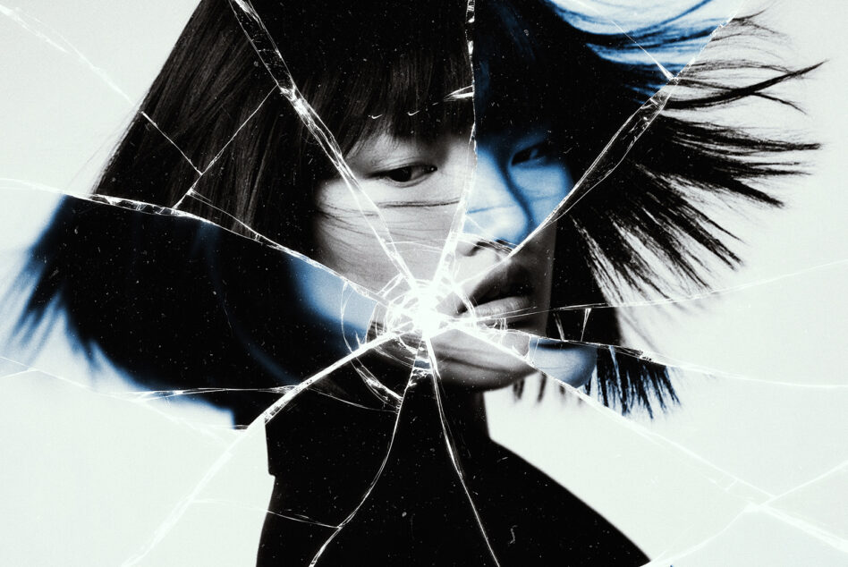Girl with dark bangs looking down with cracked glass effect overlaid, blue color grade, minimalist white background