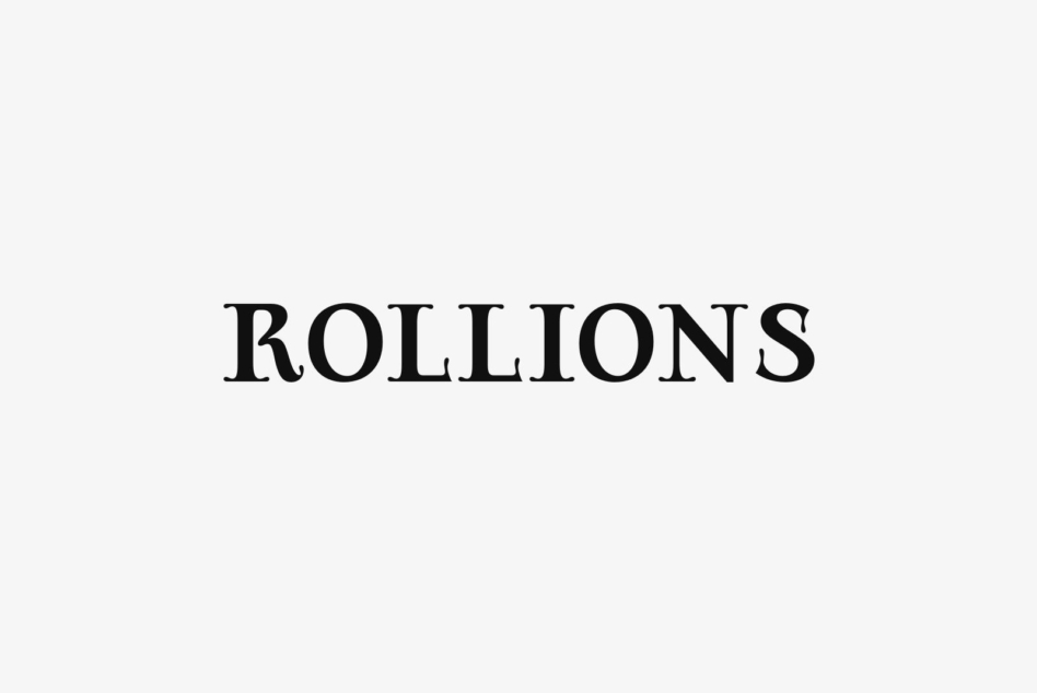 Rollions serif font in classic black letterspacing on light background