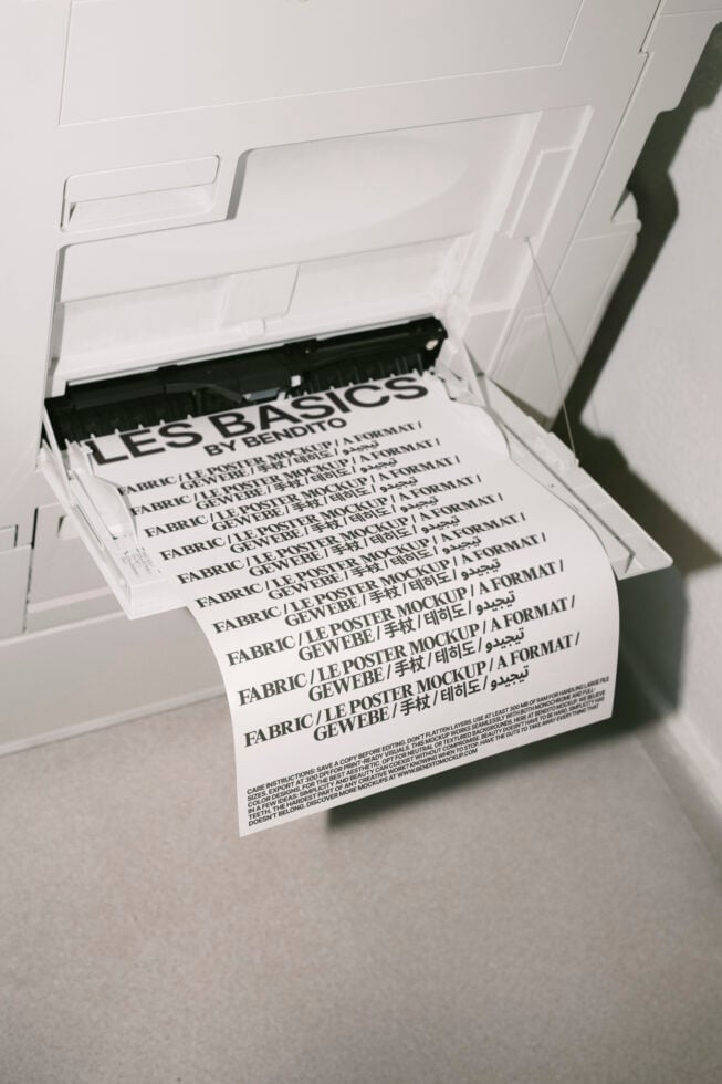 Printer output showing light poster mockups layered in white tray setup