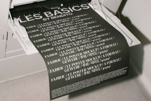 Fabric poster mockup in printer showing multilingual text suitable for graphic design templates emphasizes typography digital asset for designers