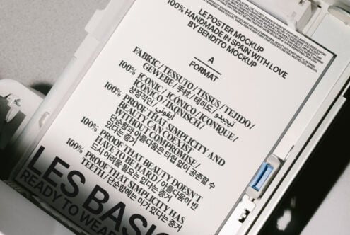 Poster mockup in a paper tray showcasing multilingual typography with bold text design. Ideal for designers seeking stylish templates and graphics.