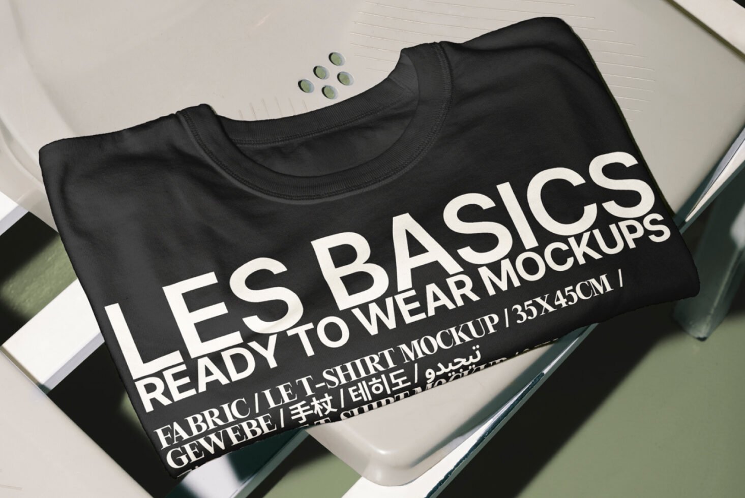 Black t-shirt mockup displaying bold Les Basics design ideal for clothing branding customizable fabric ready to wear 35x45cm template for designers