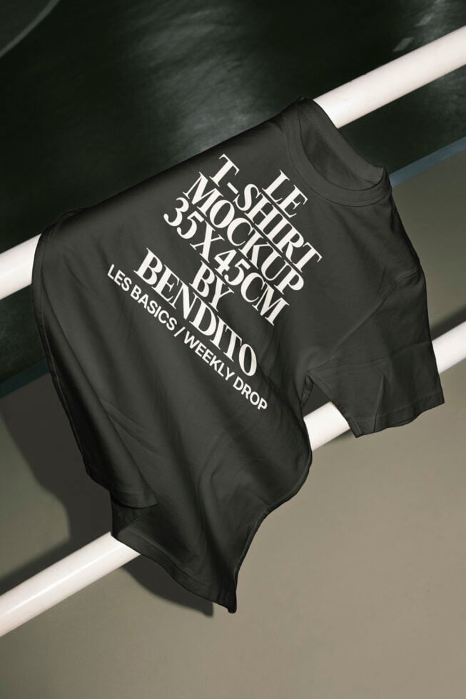 T-shirt mockup displaying large typography design draped over a white bar; ideal for designers seeking apparel mockups for presentations or branding.