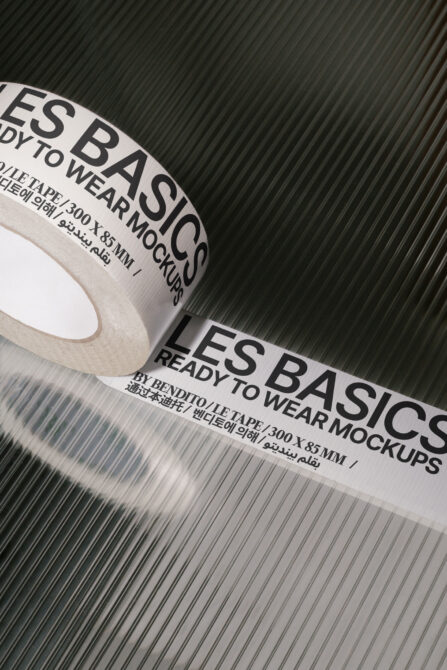 Rolled tape mockup with multilingual label on corrugated metal background