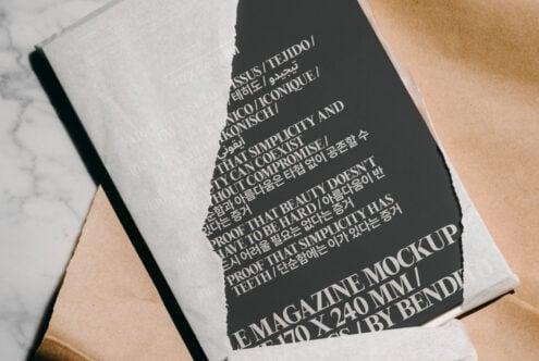 Magazine mockup with torn paper overlay showcasing bold multilingual typography. Perfect for designers seeking edgy, modern layouts. Mockups Templates.