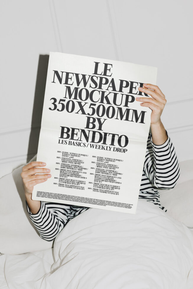 Person in striped shirt holding cream newspaper mockup 350x500mm