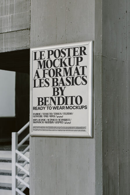 White framed poster mounted on industrial concrete wall with typography mockup design