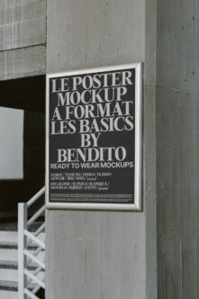 Framed poster mockup on concrete wall with Le Poster A Format Les Basics text
