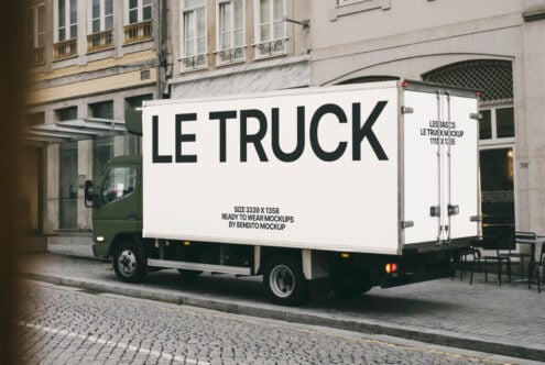 Truck mockup parked on cobblestone street near old buildings ready for branding design. Ideal for graphic designers. Realistic mockup template.