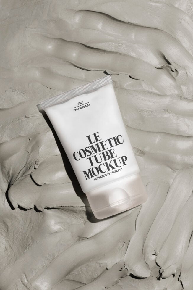Cosmetic tube mockup on textured surface ideal for designers. Realistic packaging template enhances product design presentation. Keywords: Mockup, Template, Packaging.