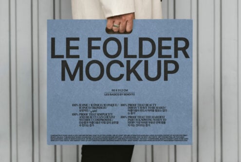 Mockup design showing a person holding a large blue folder with bold text. Ideal for presentations, graphic design projects, or digital templates.