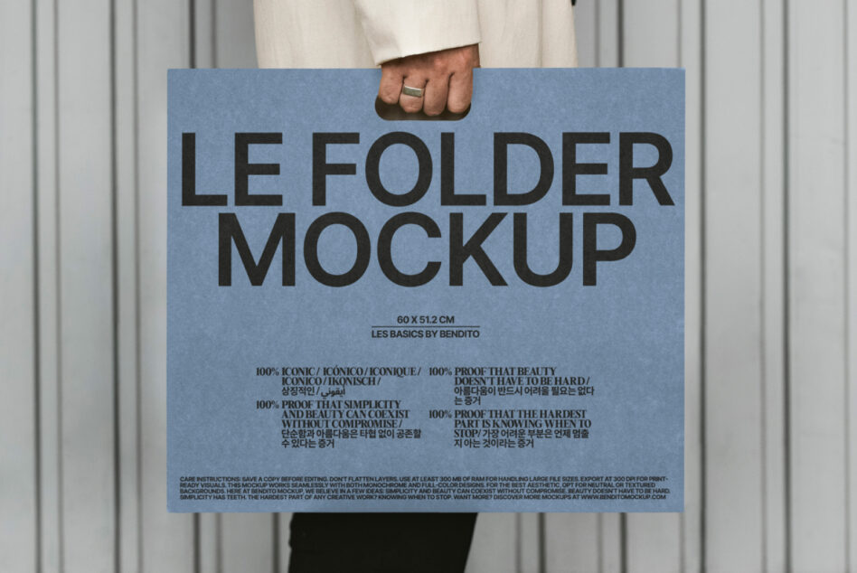 Close up of blue folder mockup being held showing full design layout