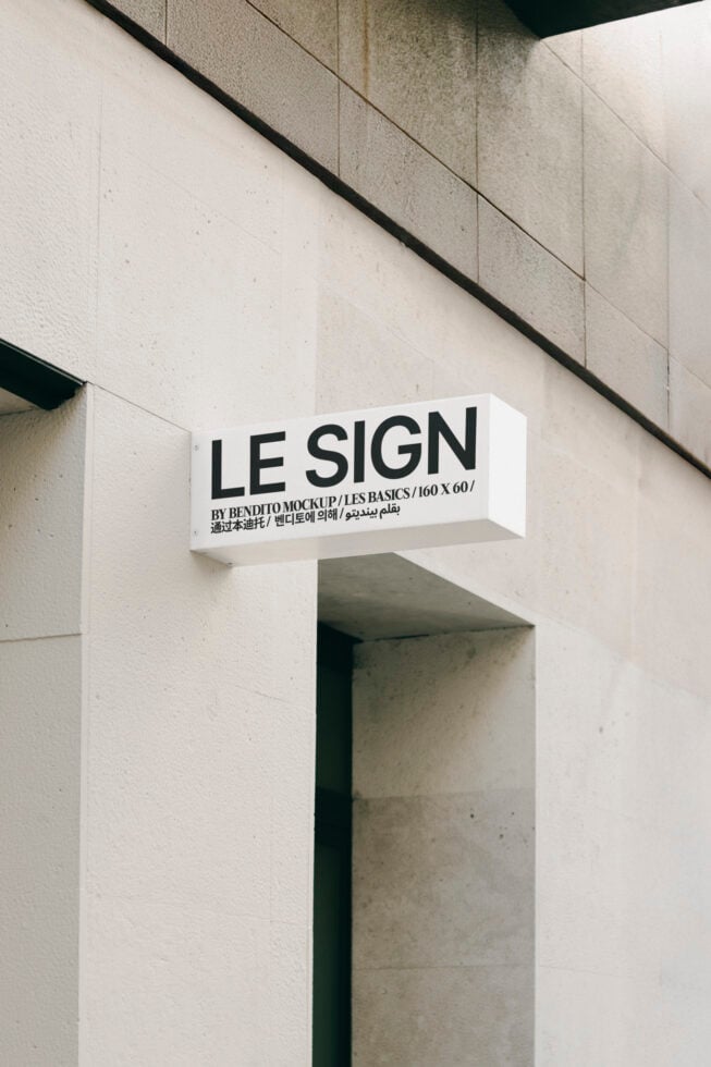 Outdoor sign mockup with modern typography on a building facade, ideal for designers. Keywords: mockup, design, typography, signage, exterior, template.