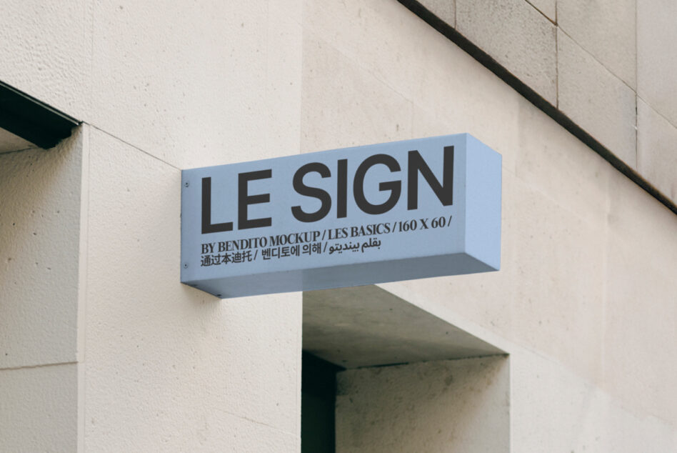 Pale blue extruded sign mounted on concrete storefront
