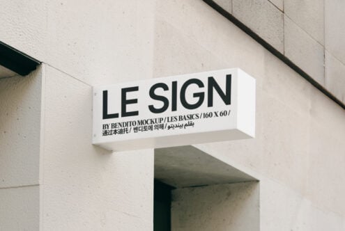 Outdoor sign mockup on building facade, 3D wall sign design, customizable template for branding presentation, ideal for graphic designers and marketers.