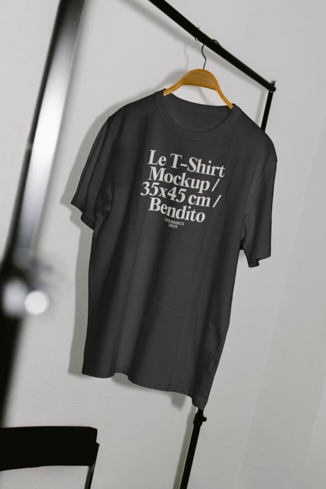 Realistic T-shirt mockup on hanger featuring minimalist design. Perfect for apparel designers, showcasing branding or logo in high-quality presentation.