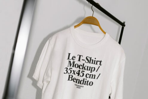 White T-shirt mockup on hanger displaying bold text; ideal for showcasing apparel designs; high-resolution, 35x45 cm; perfect for designers.