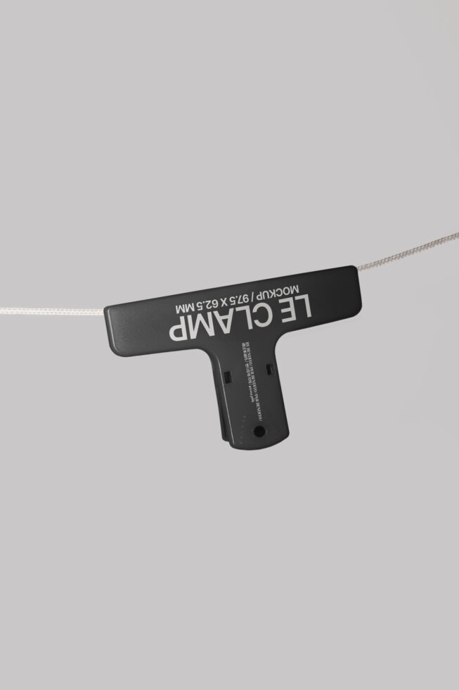 Minimalist mockup featuring a black clamp for hanging displays perfect for showcasing design templates and graphics with space for branding on a gray background.
