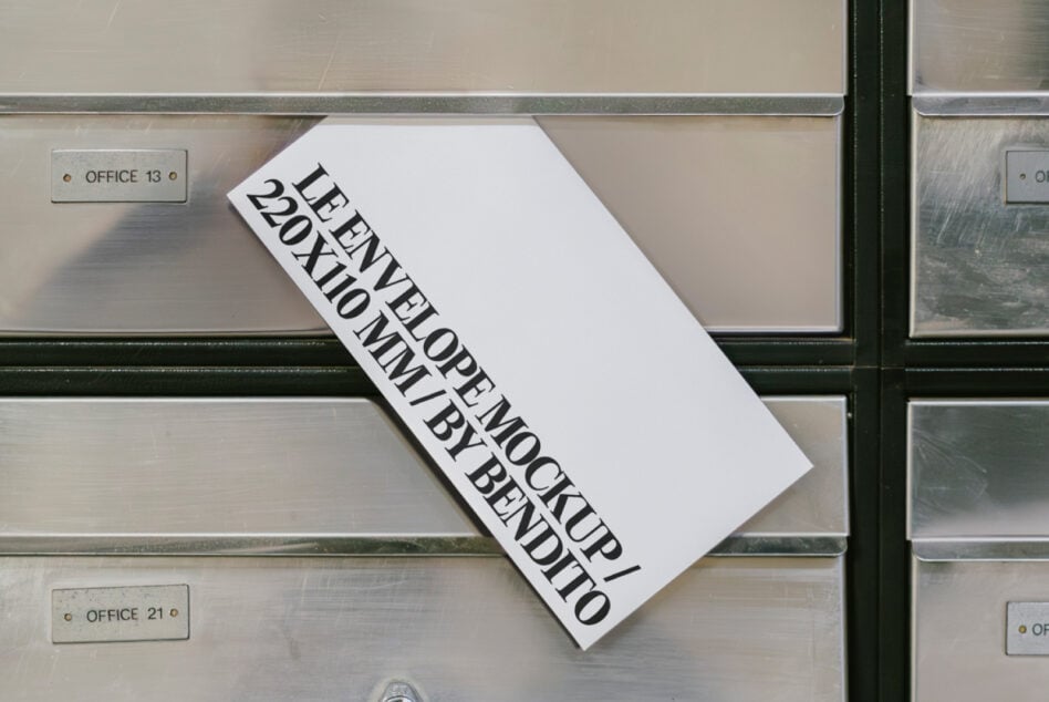 White envelope mockup resting on stainless steel mailbox with office tags