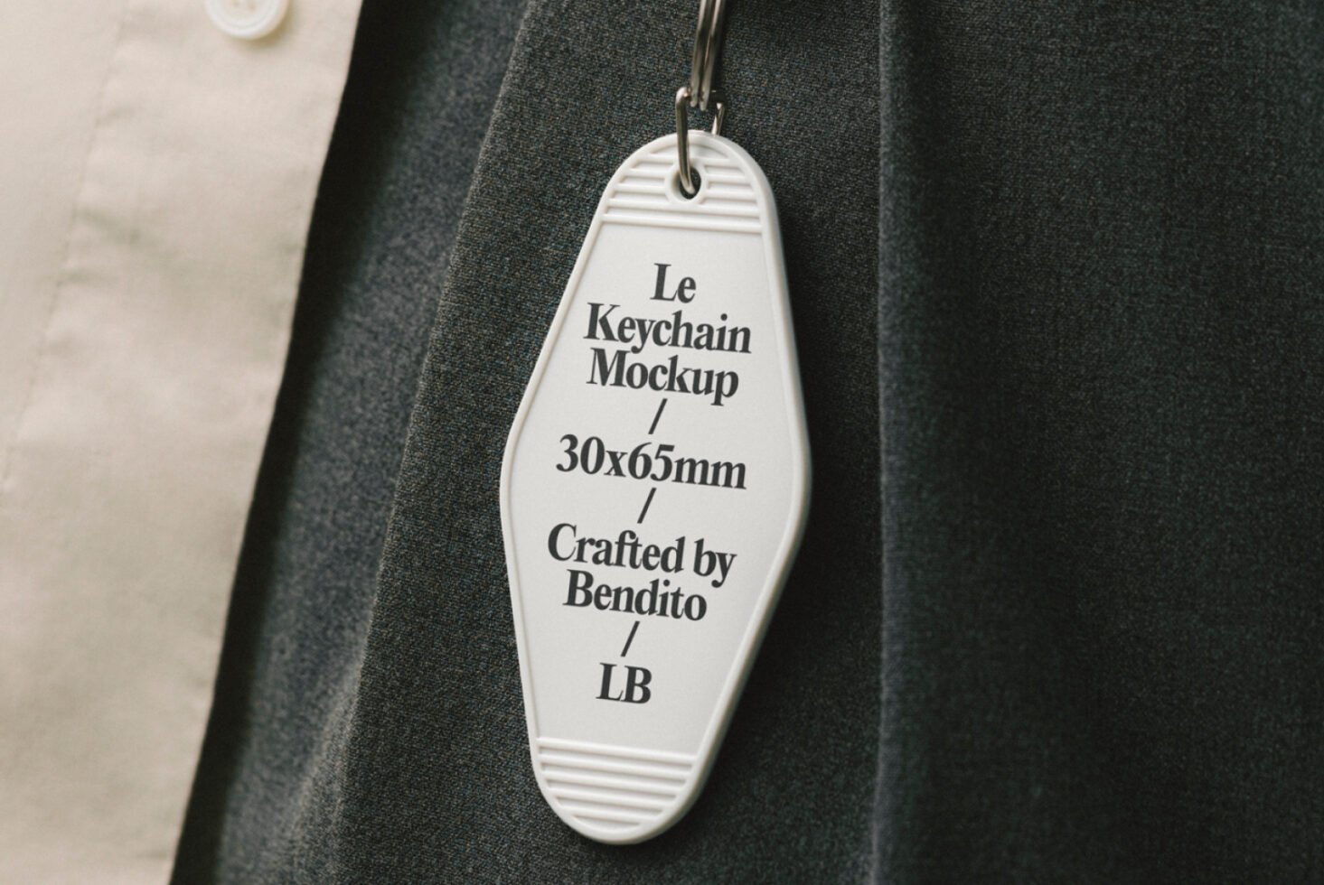 Keychain mockup displayed on fabric background with dimensions 30x65mm Crafted by Bendito ideal for designers using graphic templates and mockups