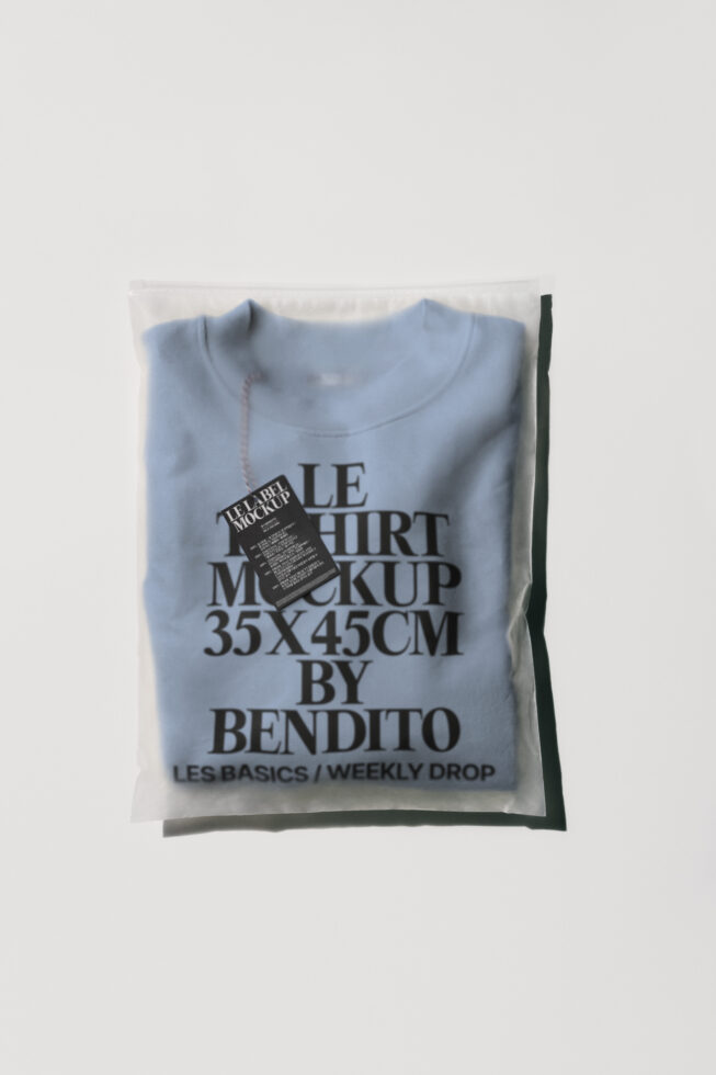Light blue crewneck tee in plastic packaging with printed label mockup