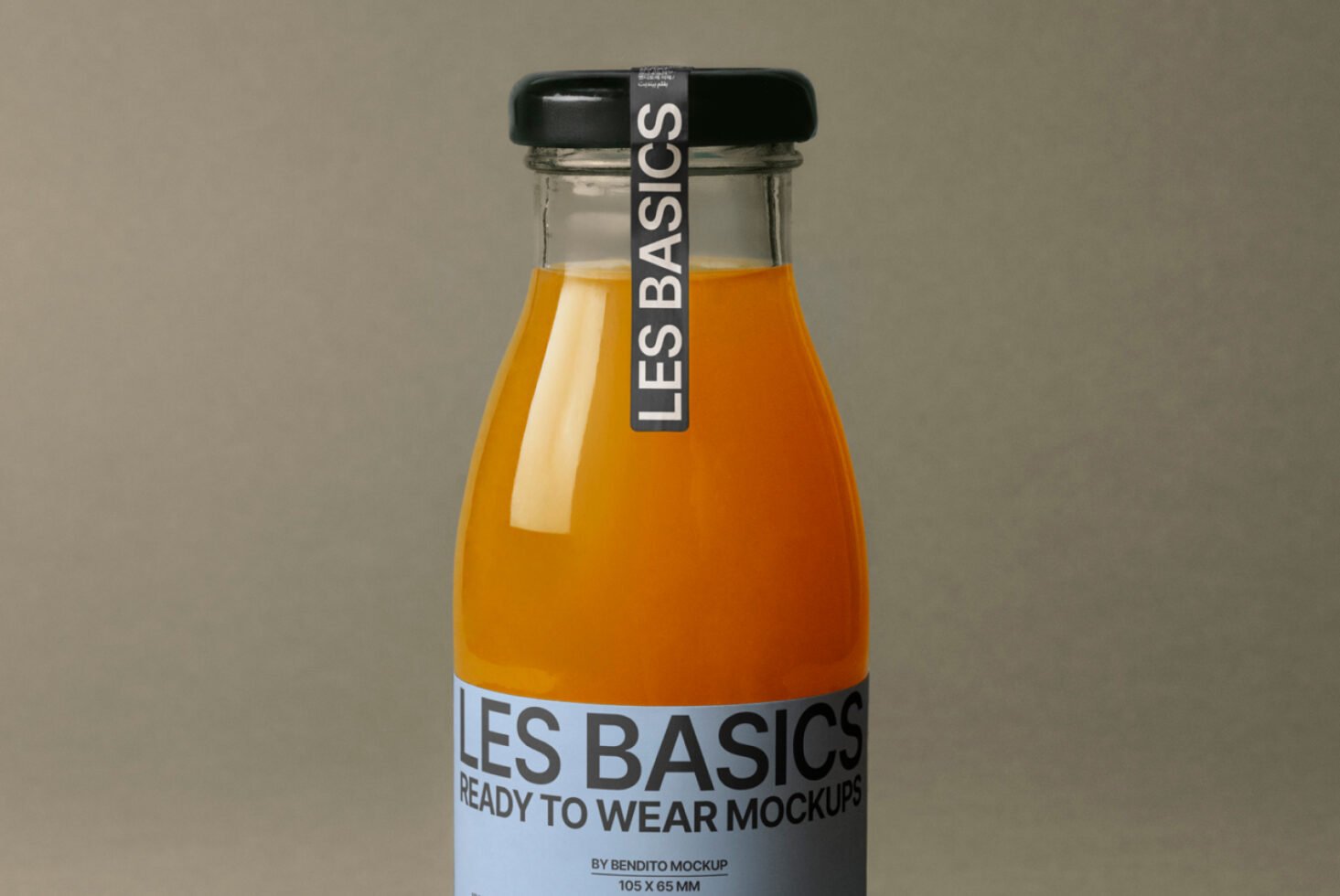 Orange juice bottle mockup with black cap and blue label reading Les Basics on a neutral background. Perfect for packaging designs and branding templates.