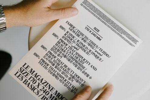 Magazine mockup featuring bold typography and multilingual text on a white cover. Ideal for designers focusing on fonts and editorial templates.
