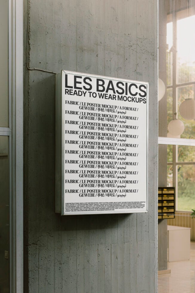 Vertical poster inside office titled Les Basics Ready to Wear Mockups. Ideal for displaying fabric textures and typography templates in professional settings.