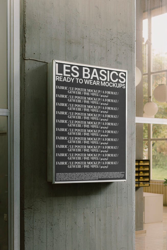 Modern poster mockup on concrete wall. Bold text Les Basics in multiple languages. Ideal for graphic design templates or marketing presentations.
