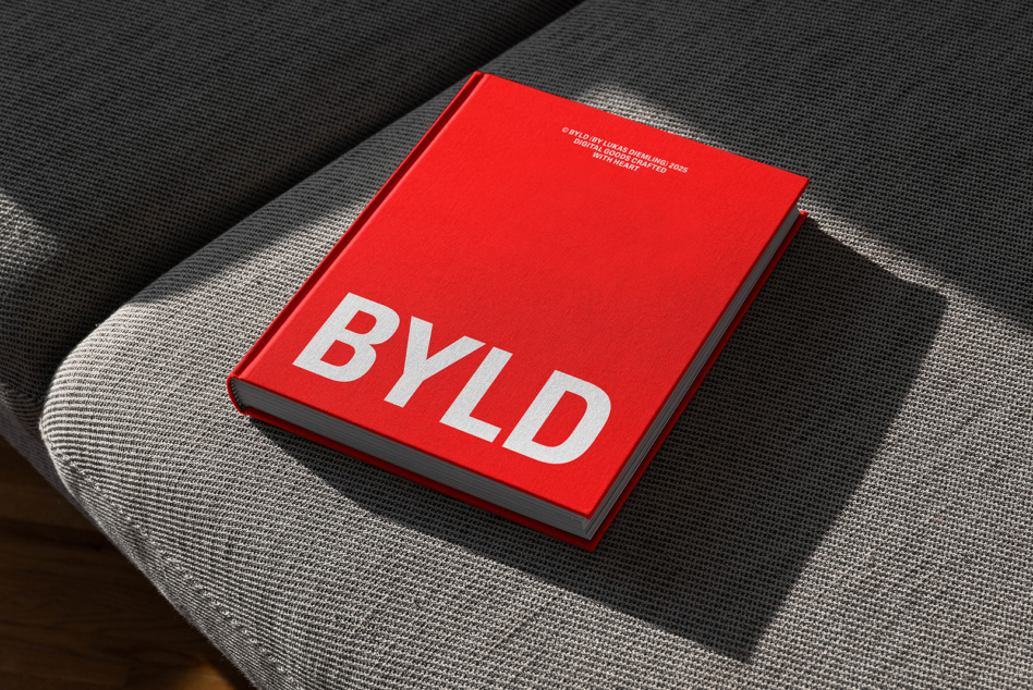 Red hardcover book mockup on textured surface with bold white lettering on spine