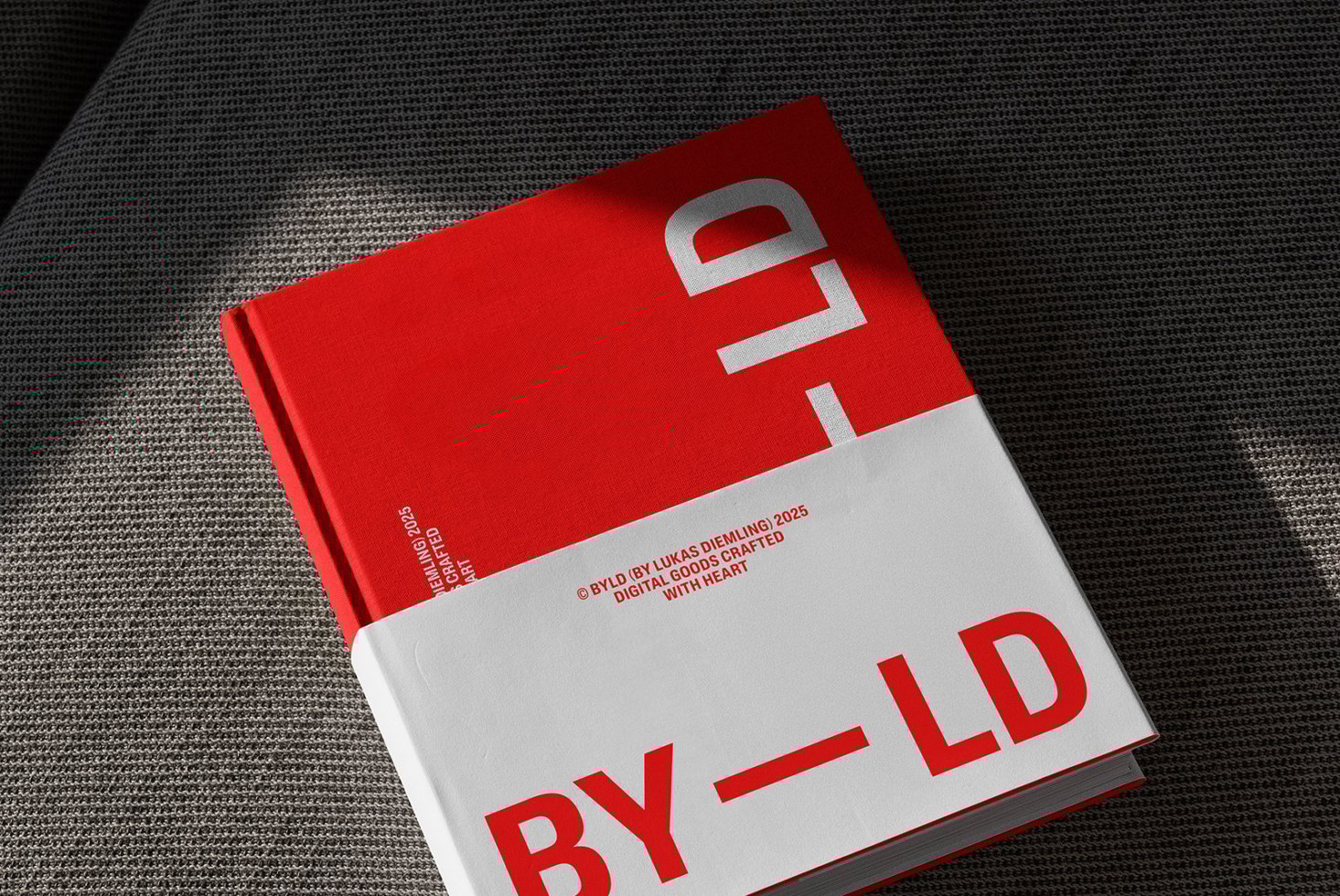 Hardcover book mockup with red and white design showcasing modern typography. Ideal for designers in need of stylish book cover templates and graphics.