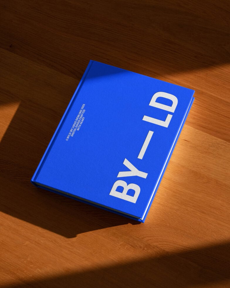 Blue book cover mockup on wooden surface with bold white text for design presentation. Ideal for showcasing templates, book design, and print graphics.