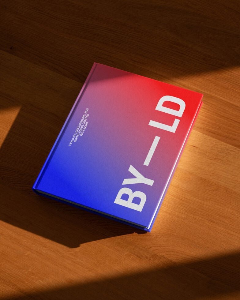 Bold book cover with BY LD text on a red to blue gradient. Ideal for design mockups or digital graphic projects. Modern aesthetic on wood surface.