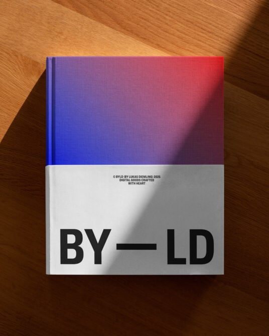 Gradient cover shifting blue to red, white band, modern book design flat lay