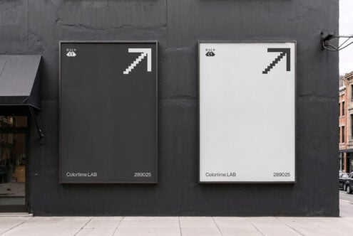 Street view of two minimalist posters with pixelated arrow designs in black and white. Ideal for mockup templates, urban digital graphics, design assets.