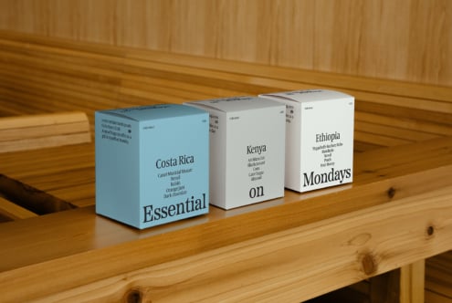 Coffee packaging design mockup featuring Costa Rica, Kenya, and Ethiopia varieties on wooden shelf. Ideal for packaging designers and branding projects.