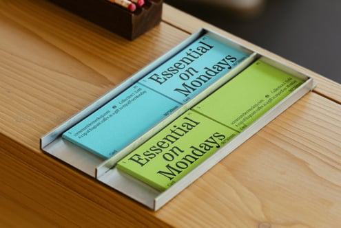 Essential on Mondays card mockups on a wooden table showcasing creative layout design ideal for designers seeking unique templates and graphics assets