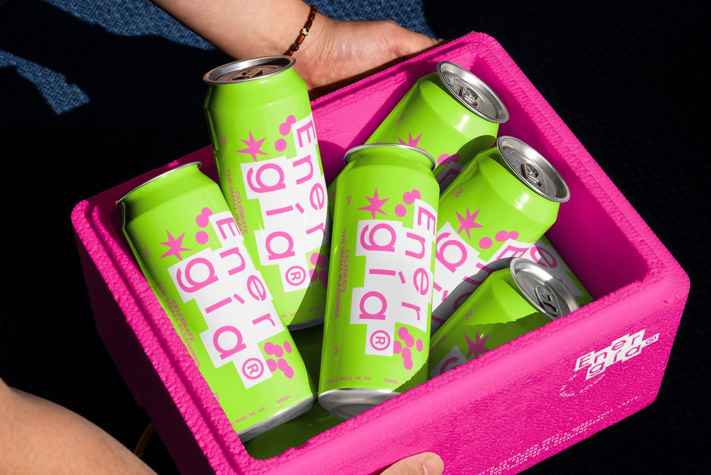 Bright green energy drink cans with vibrant pink branding in a bold pink box ideal for design mockups creative packaging digital assets templates