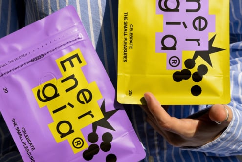 Vibrant packaging design mockup with bold typography. Purple and yellow pouches with zipper. Ideal for product branding and graphic design projects.