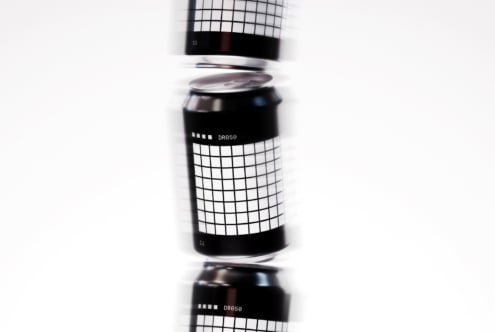 Floating aluminum can mockup with grid design on clean white background ideal for showcasing branding packaging design high-quality realistic template.