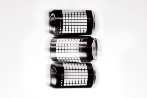 Three aluminum cans with a geometric grid pattern on a white background. Ideal for mockup, branding, packaging, product design, digital assets for designers.