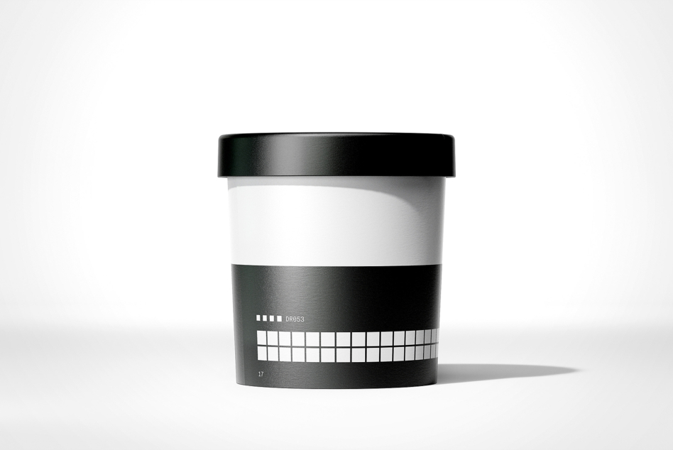 Black ice cream tub with white band showing color swatch grid labeled DR053