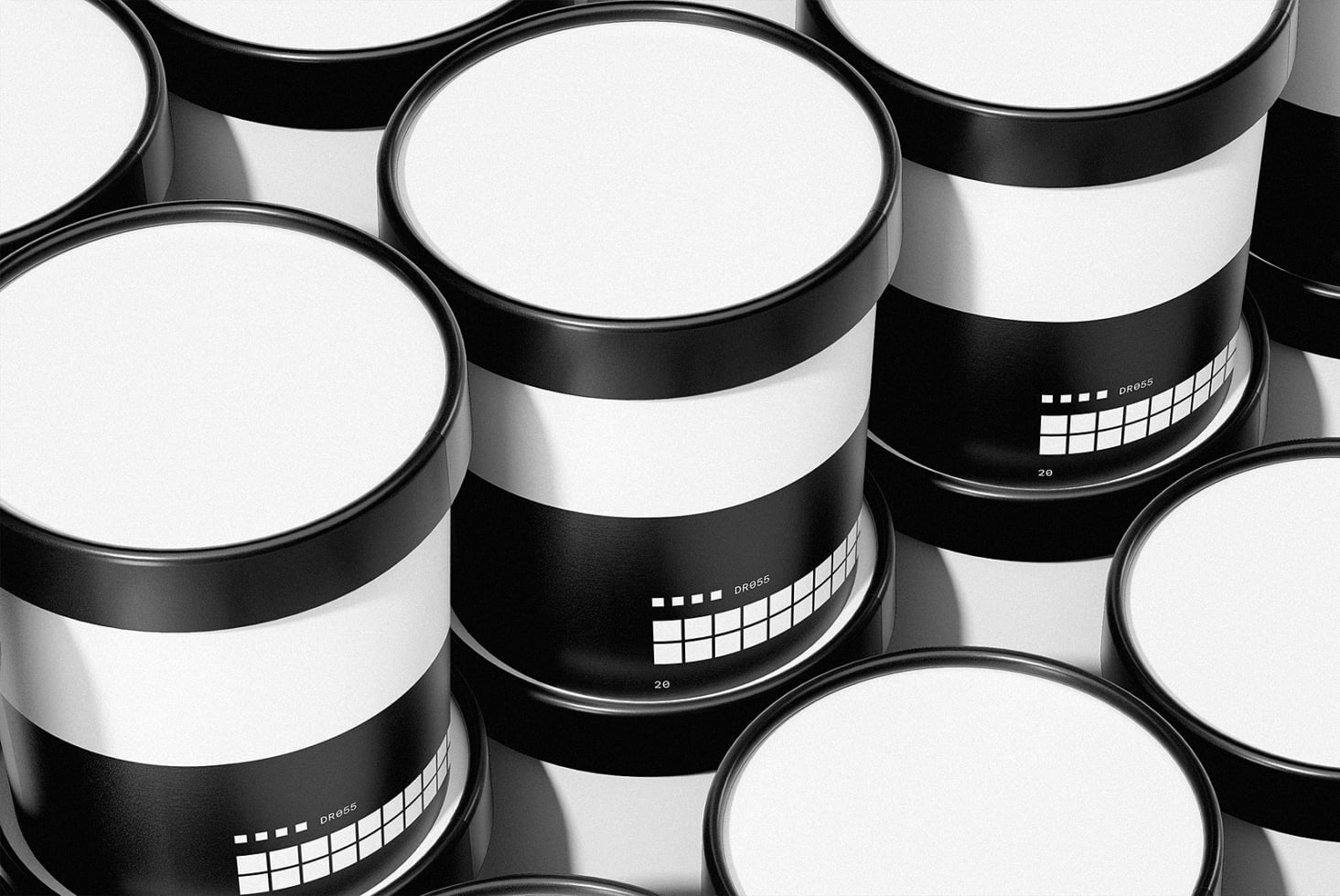 Flat lay of black cylinder containers with white lids, minimal packaging mockup