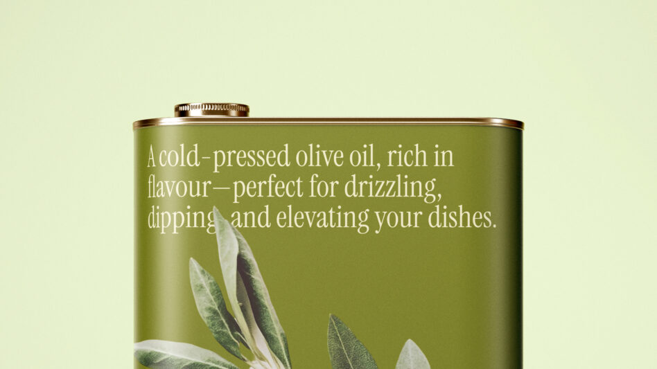 Flat lay of wide olive oil tin with descriptive text, soft green background