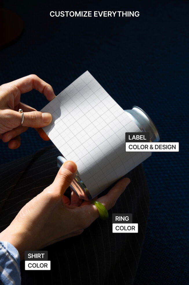 Person holding a blank grid paper wrapped around a can, customizable label, design, and color options for mockup templates. Ideal for designers.