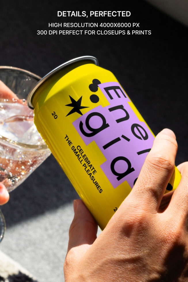 Closeup of a hand holding a vibrant yellow energy drink can with decorative text design. Perfect for product mockups and graphic design projects.